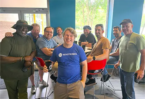Nuvotronics team members smiling at camera