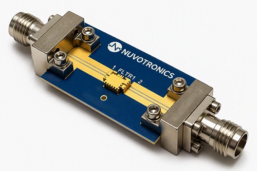Connectorized RO4350B evaluation board with the PolyStrata filter mounted between two 2.4 mm connectors